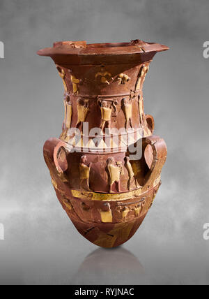 Inandik Hittite relief decorated cult libation vase with four decorative friezes featuring figures coloured in cream, red and black. The processional  Stock Photo