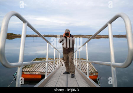 Nature photographer taking picture. Norway. Stock Photo