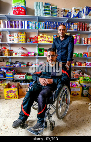 Ibrahim Nasser Ibrahim Irzaqat runs a grocery shop in Taffoh, West Bank, Palestine. He received an interest-free U.S.$4000 loan from ACAD finance. Stock Photo