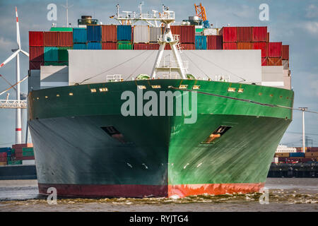 Frontal shot of a green container ship Stock Photo