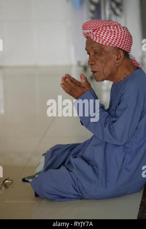Masjid Nia'mah mosque.  Old muslim man praying.  Chau Doc. Vietnam. Stock Photo