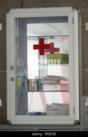 First aid box hanging on the wall. Vung Tau. Vietnam. Stock Photo