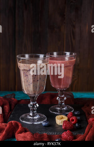 Photo of two wineglasses with smoothies on table Stock Photo