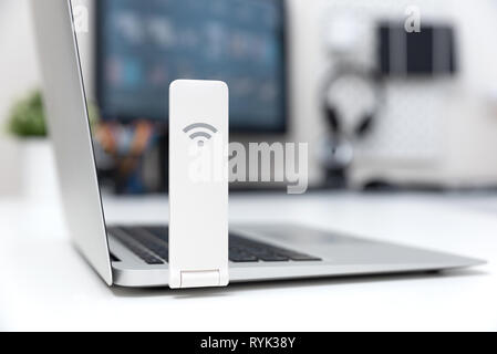 Wireless internet concept. Mobile network expander or mobile internet modem USB stick Stock Photo