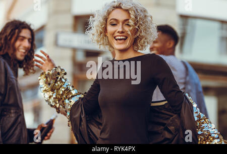 QUITO, ECUADOR -8 OCTOBER, 2016: Young ecuadorian woman wearing official  Marathon football shirt standing facing camera, very engaged body language  watching game with great enthusiasm, blue sky and clouds background Stock  Photo - Alamy