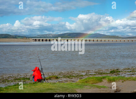 A person fishing for flat fish, Arnside, Cumbria, England. Stock Photo