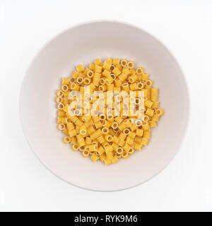 Some small pieces of dried pasta on a plate Stock Photo