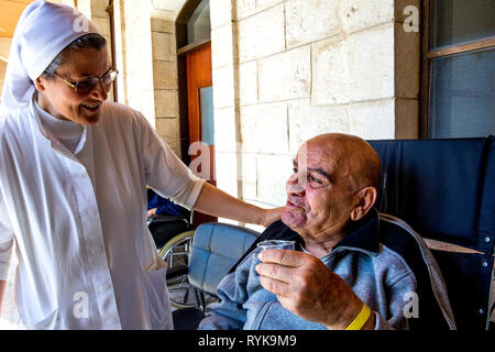 St Vincent de Paul hospital, run by the Daughters of Charity catholic missionaries in Nazareth, Israel. Geriatric ward. Stock Photo