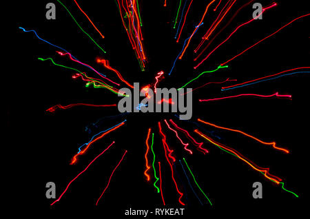 Abstract Colorful streaks of light moving to center Stock Photo