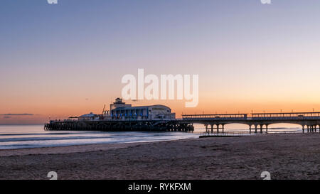 Glorious sunset over the beautiful pier and the sandy beach of Bournemouth, England Stock Photo