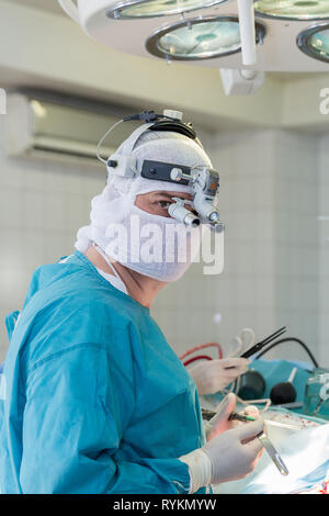 surgeon in the operating room Stock Photo