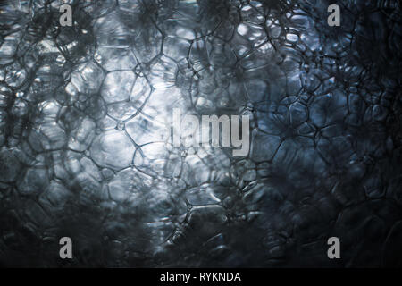 Macro close-up of many soap bubbles in the water as a background Stock Photo