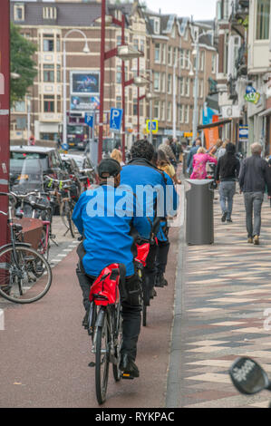 A Dutch woman semi naked on a bicycle in a Sex museum in the Amsterdam