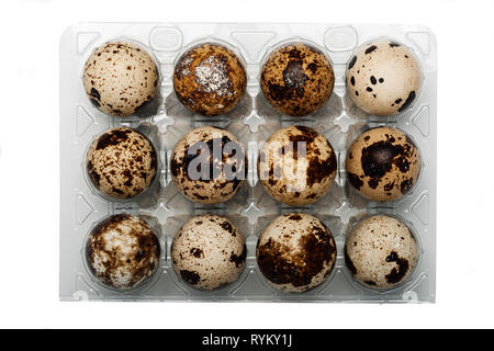 A dozen Quail eggs on a white background Stock Photo