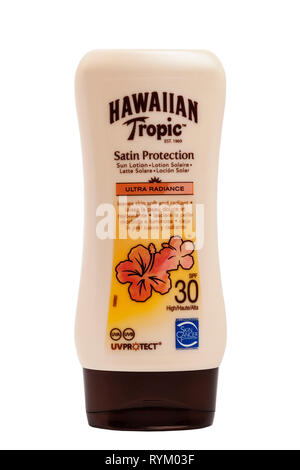 A tub of Hawaiian Tropic sun lotion cream with uv protection on a white background Stock Photo