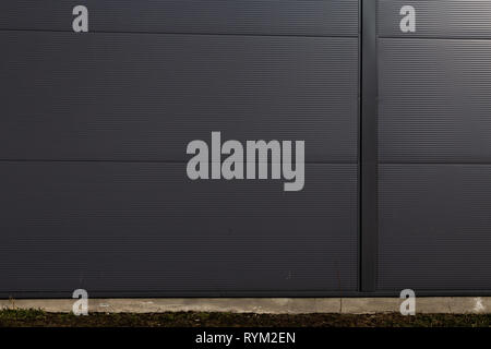 Blank ad space on a concrete wall in the street outside Stock Photo