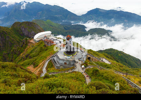 Sapa, Vietnam - October 08, 2018: A view to the Big Buddha statue and the cable car from the summit of the Fansipan Mountain on October 8, 2018, in Sa Stock Photo