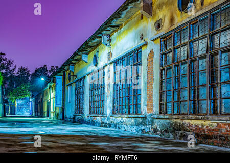 GUANGZHOU, CHINA - OCTOBER 19: Old abandoned warehouse buildings at Redtory Art and Design Factory at night on October 19, 2018 in Guangzhou Stock Photo