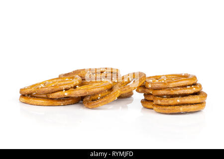Lot of whole mini salted pretzels isolated on white background Stock Photo