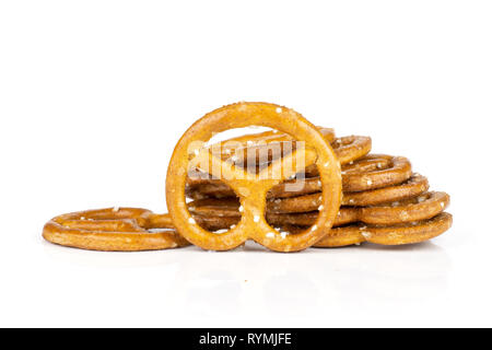 Lot of whole mini salted pretzels heap isolated on white background Stock Photo