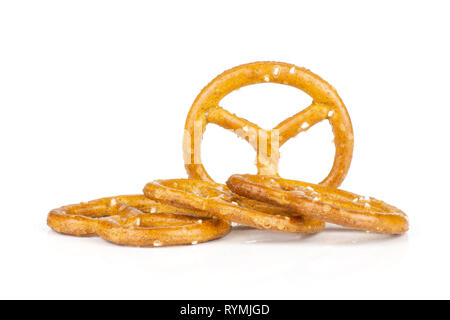 Group of four whole mini salted pretzels isolated on white background Stock Photo