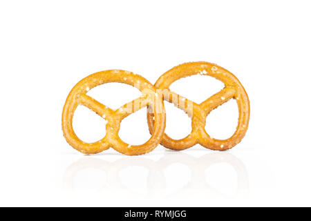 Group of two whole mini salted pretzels isolated on white background Stock Photo