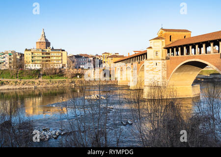 Travel to Italy - panoramic view of Pavia city with Ponte Coperto (covered bridge, Ponte Vecchio, Old Bridge) over Ticino River and Duomo Cathedral in Stock Photo