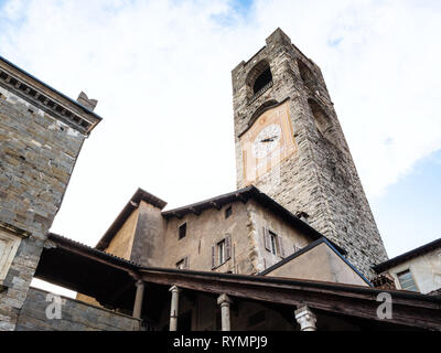 Travel to Italy - Campanone (Torre civica) bell tower over Palazzo del Podesta on Piazza Vecchia square in Citta Alta (Upper Town) of Bergamo city, Lo Stock Photo