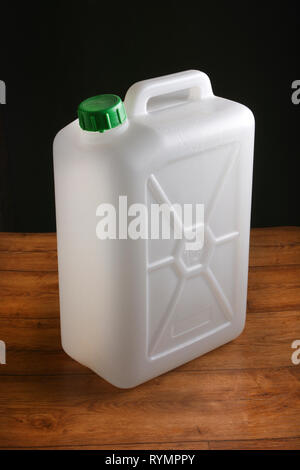 plastic food container on wooden table on the black background - closeup Stock Photo