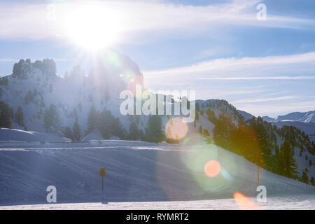Sunset at Penken ski resort in Zillertal in Tyrol. Austria in winter in Alps. Alpine mountains with snow. Downhill fun. Blue sky and white slopes. At  Stock Photo