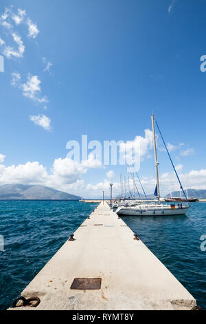 Yachts and sailboats dock at a harbor in Sami, Kefalonia, Greece on the Ionian Sea. Stock Photo