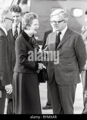 Prime minister Margaret Thatcher leaving London's Heathrow to Moscow with Foreign secretary Geoffrey Howe. Stock Photo