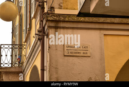 Verbania, Piedmont, Italy. March 2019. In the historic center, on the lakeside promenade, a plaque shows the level reached by the lake in 1868. Stock Photo