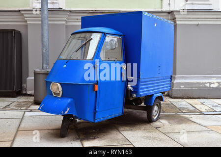 Piaggio Ape in blue color. Piaggio Vespa Car, also called Piaggio Tri Vespa. Italian three-wheeled light commercial vehicle. Stock Photo