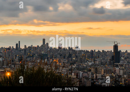 This is a capture of the sunset in Beirut capital of Lebanon with a warm orange color, and you can see Beirut downtown Stock Photo