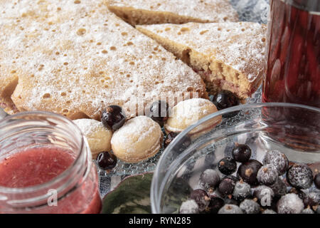 Cake with berries on a plate, closeup. Frozen berries in a plate. Stock Photo