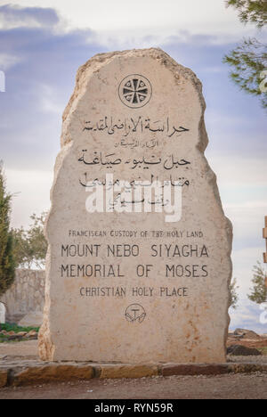 Stone at the entrance of the Nebo Mount with inscription Franciscan custody of the Holy Land, Mount Nebo Siyagha Memorial of Moses, Christian holy pla Stock Photo