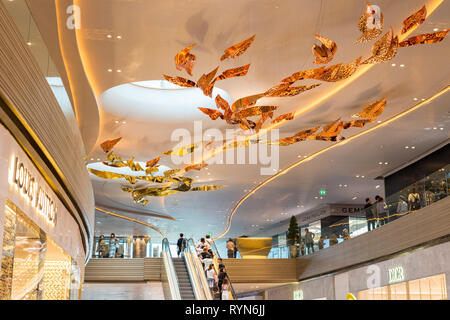 Bangkok, Thailand - December 15, 2018: an interior of Iconsiam Shopping Mall, a ceiling decoration above Louis Vuitton, Gems Pavilion and Dior stores. Stock Photo