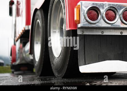 Powerful Semi Truck Tractor Rear View. Heavy Duty Transportation Industry Concept. Stock Photo