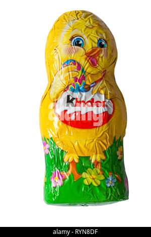 Kinder Easter chick chocolate isolated on white background - fine milk chocolate shell with milky white lining - ready for Easter Stock Photo