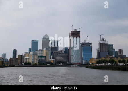 High-rise buildings - including One Canada Square, Newfoundland and the Landmark Pinnacle - create a city skyline on Canary Wharf in London, UK. Stock Photo