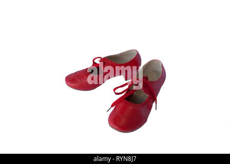 Red leather pair of shoes for female dancer. Traditional retro style footwear Stock Photo