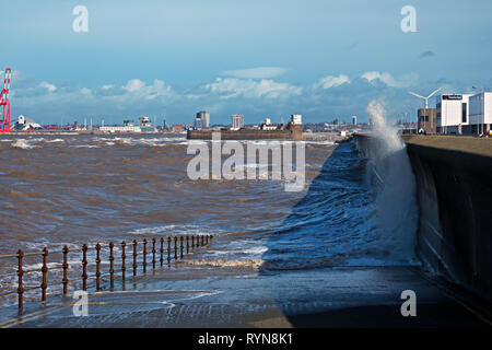 Huge waves crash over the sea wall at New Brighton Merseyside UK Stock Photo