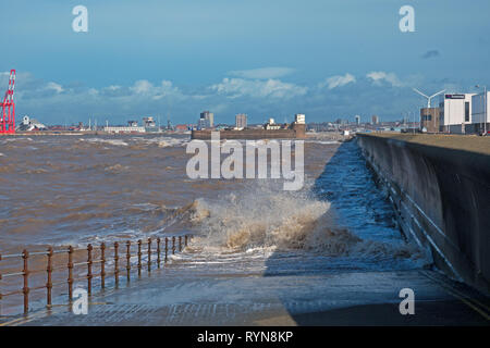 Huge waves crash over the sea wall at New Brighton Merseyside UK Stock Photo