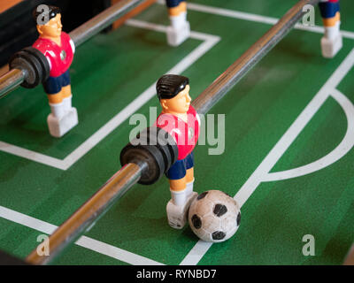 Footballer and ball on a football soccer table Stock Photo