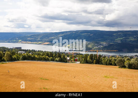 Landscape with wheat field, river and mountains in Norway. Stock Photo