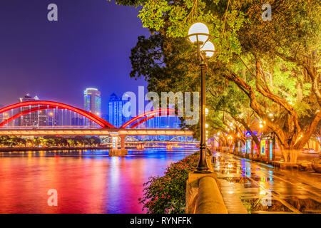 GUANGZHOU, CHINA - OCTOBER 24: Night view of riverside park and the fanous Jiefang Bridge along the Pearl River on October 24, 2018 in Guangzhou Stock Photo