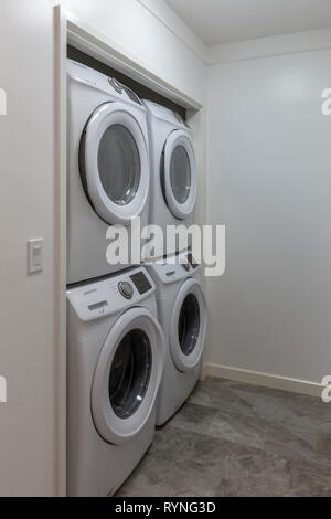 Laundry room interior washer and dryer Stock Photo