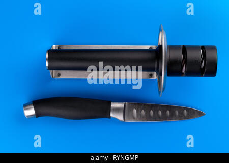 kitchen knife blade on grindstone Stock Photo - Alamy