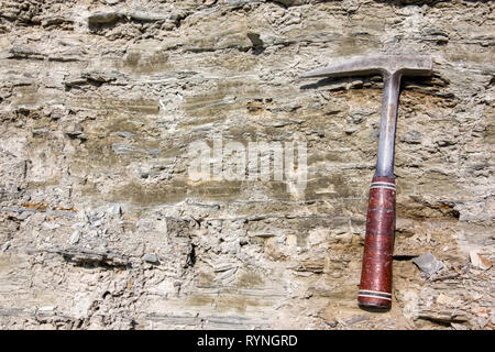 Geological hammer on the rocks Stock Photo